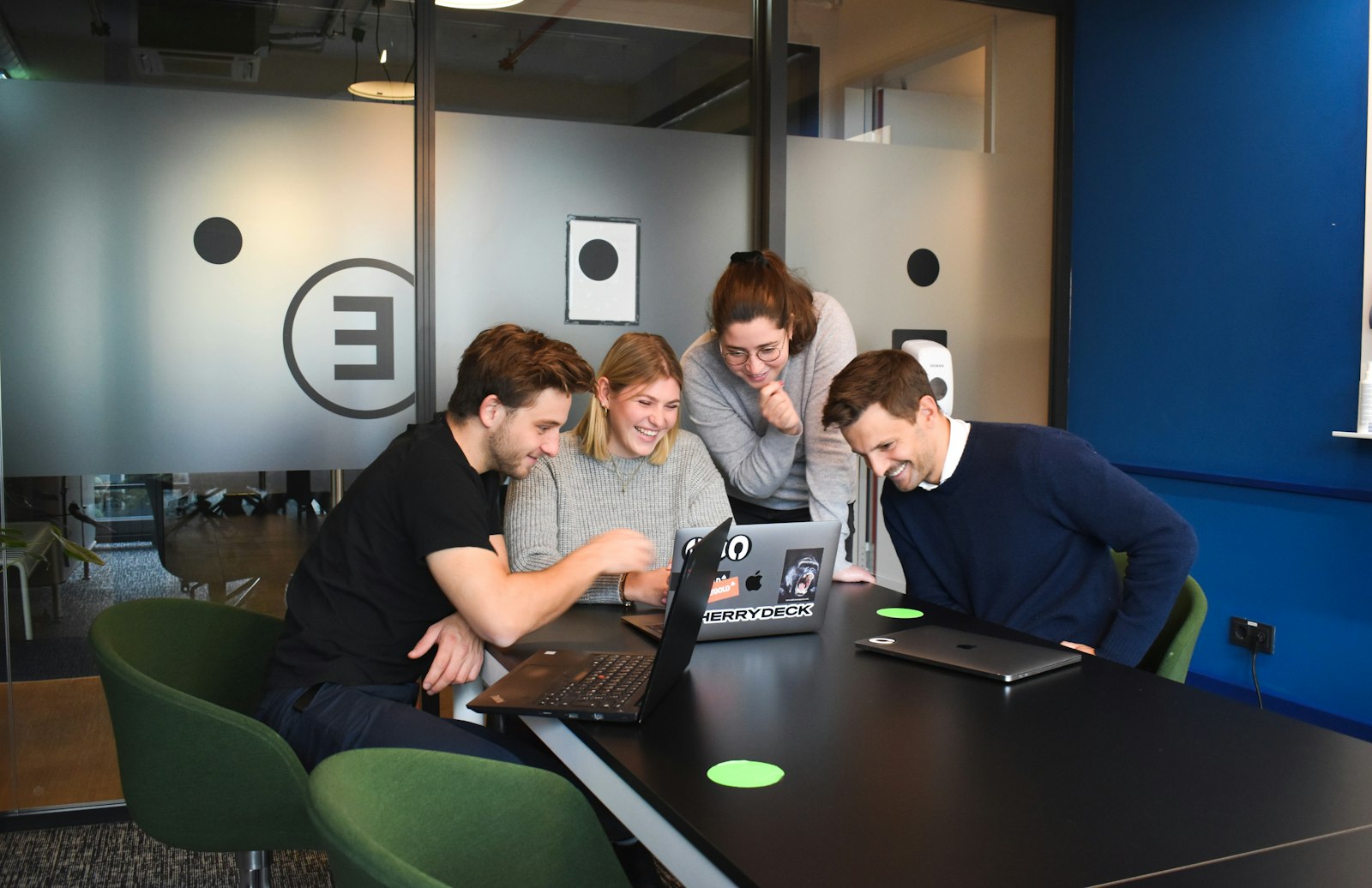 Young people working together around a table on a group project