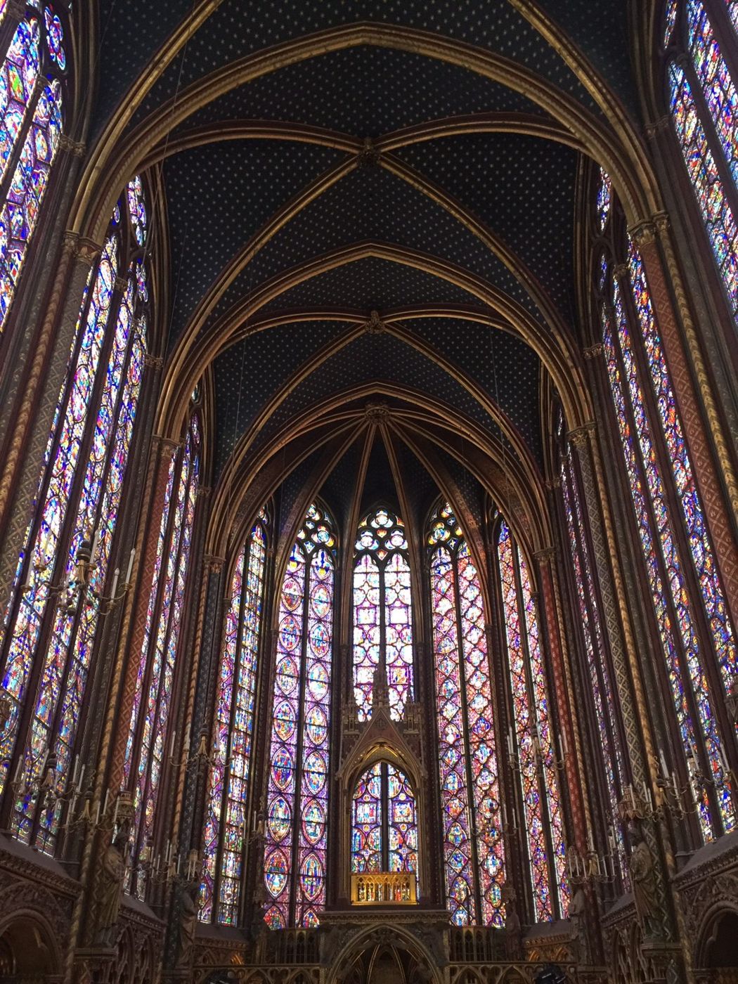 Stained-glass windows rising to the vaulted ceiling of the Sainte-Chapelle, Paris
