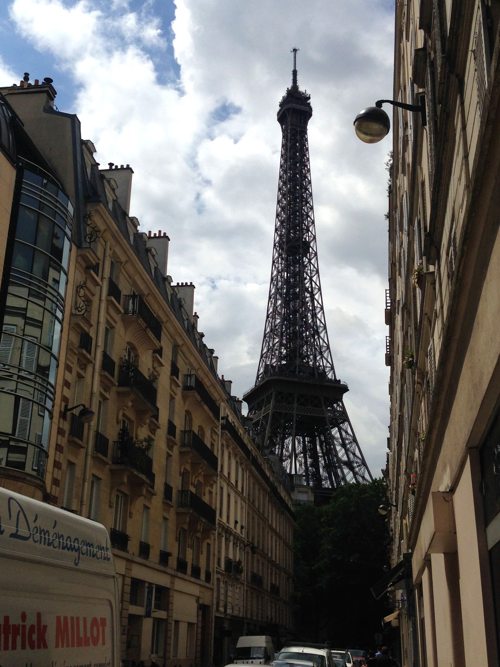The Eiffel Tower seen down a narrow Paris street